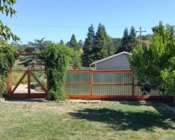 Corrugated fence with double gate in novato